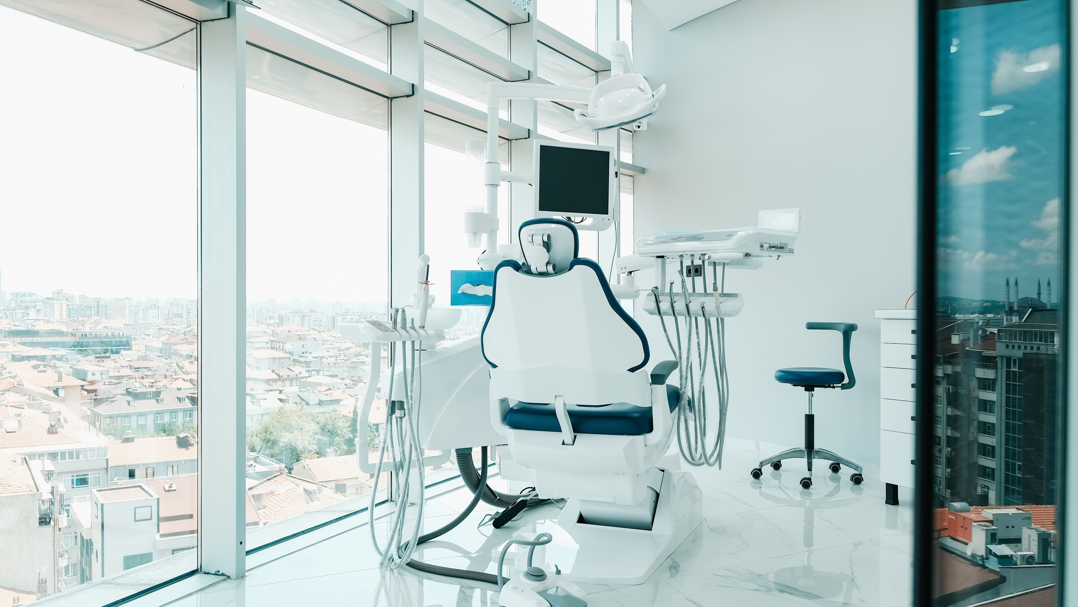 Modern dental office interior showing operatory with dental chair and equipment